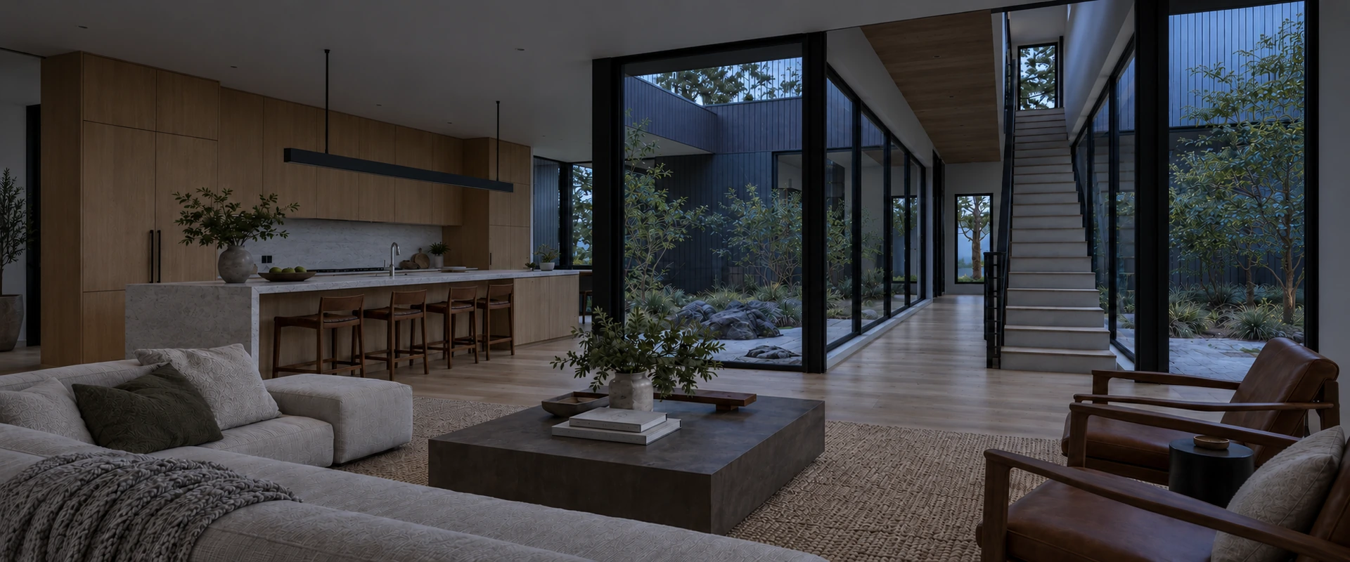 A panoramic Wilburton interior with a linear pendant, timber kitchen and glass courtyard